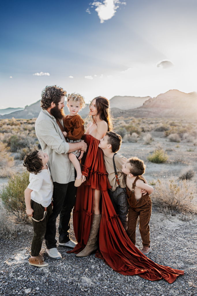 A stylish family dressed in coordinated outfits for their photo session, highlighting their unique personalities