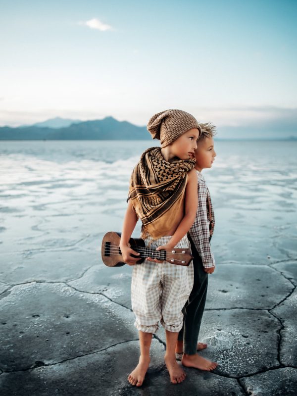 Brothers enjoying the Utah Salt flats while playing music.